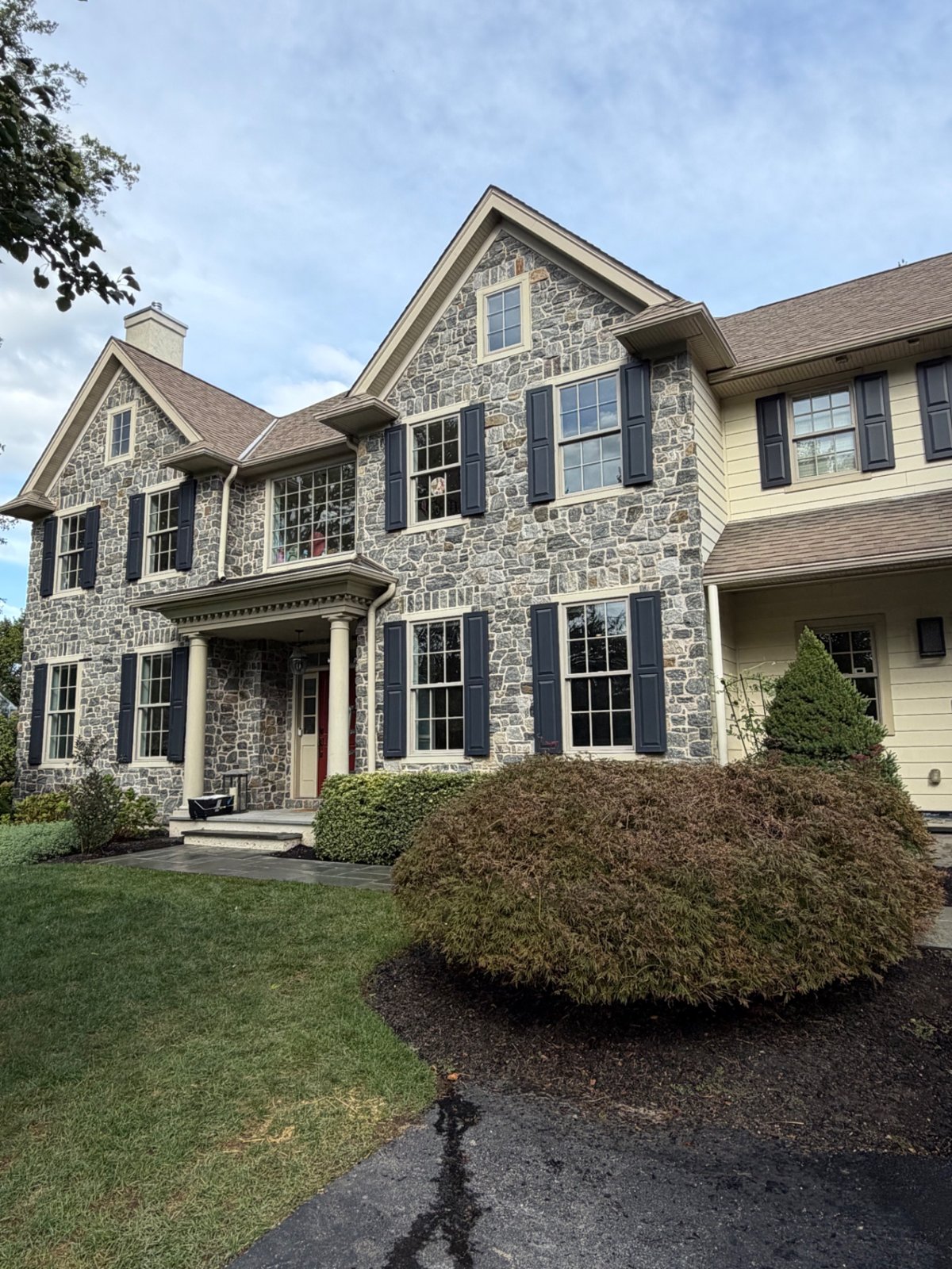A stone-front home finished by J&G Construction